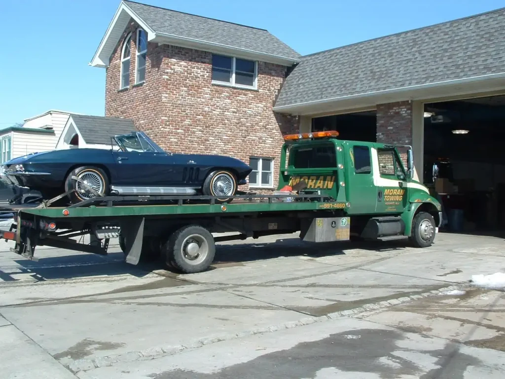 Moran Light Duty Towing Truck Carrying a Corvette